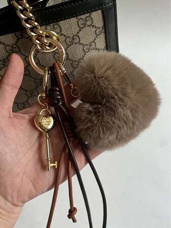 Stylish And Sophisticated Metal Heart And Letter Keychain With Fluffy Heart And Gold-Brown Leather Braided Strap Bag Charm, Blue And Silver Leather Braided Strap With Keychain, Car Keychain, Autumn/Winter Style Keychain, Bag Accessory, Bag Pendants,Bag Chain,Bag Charms,Bag Decoration Keychain,Bag Accessories