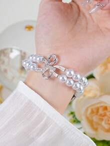 1 Correa elástica de alta gama con doble hilera de perlas, compatible con Apple Watch de 38 mm, 40 mm, 41 mm, 42 mm, 44 mm, 45 mm, 46 mm y 49 mm. Estilo moderno para mujer. Compatible con pulseras inteligentes UltraS10/S11/9/8/7/6/5/4/3/2/1 (excepto el reloj). El mejor regalo para novias y amigas. Perfecto para San Valentín, Navidad, Año Nuevo, Día de la Madre, Acción de Gracias y como regalo sorpresa para familiares o amigos. - Plateado - Ver 9