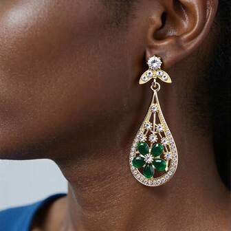 Düğünler, ziyafetler ve gösteriler için uygun, zarif retro orkide şeklinde reçine kakmalı bohem damla küpe çifti.