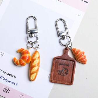 Sött realistiskt brödhänge i form, croissant-kaffekopphänge, mini-matleksak med bröd och tårta, hartskräm, gör-det-själv-tillbehör, kaffebrödset med myntbörshänge, lämplig för väskflik, dragkedja, telefonkedja, hörlurar, anteckningsbokshänge, ryggsäck, plånbok, nyckel, väskkedja, väskdekoration, nyckelring, väsktillbehör, festpresenter, små bakpresenter