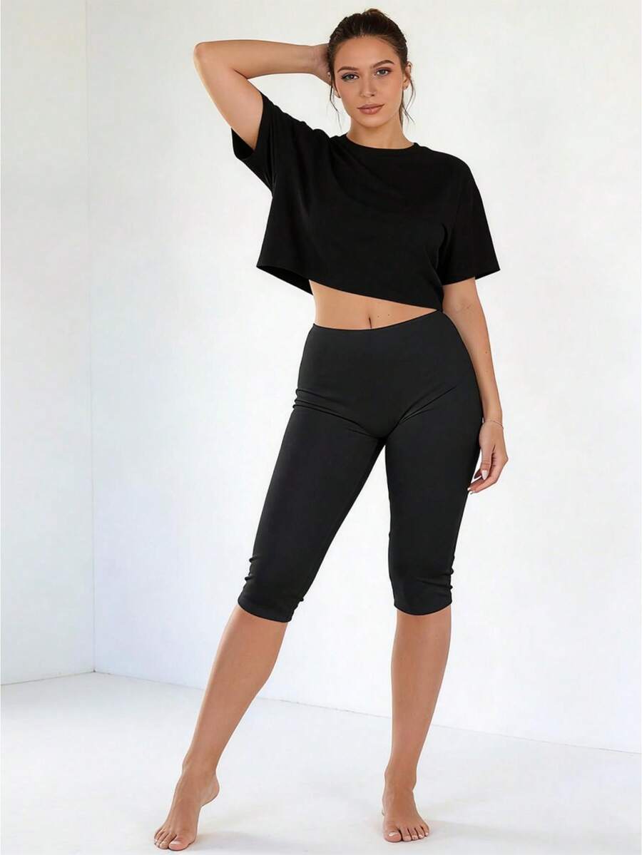 Women's Short, Fitted Leggings, Made With Stretchy Fabric, Featuring Anti-Exposure Shorts And Knee-Length, Lightweight Pants, Perfect For Comfortable And Form-Fitting Wear During Sports And Fitness Activities. - 黑色 - 查看 1