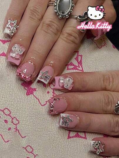 Sanrio 24 piezas Conjunto de calcomanías para manicura francesa de estilo cuadrado corto con temática de Hello Kitty, incluye Hello Kitty 3D, estrellas, flores y decoraciones de rhinestone, 1 pieza de gel de gelatina y 1 pieza de lima de uñas, adecuado para mujeres y niñas para uso diario y de fiesta, uñas de estilo pastel y femenino