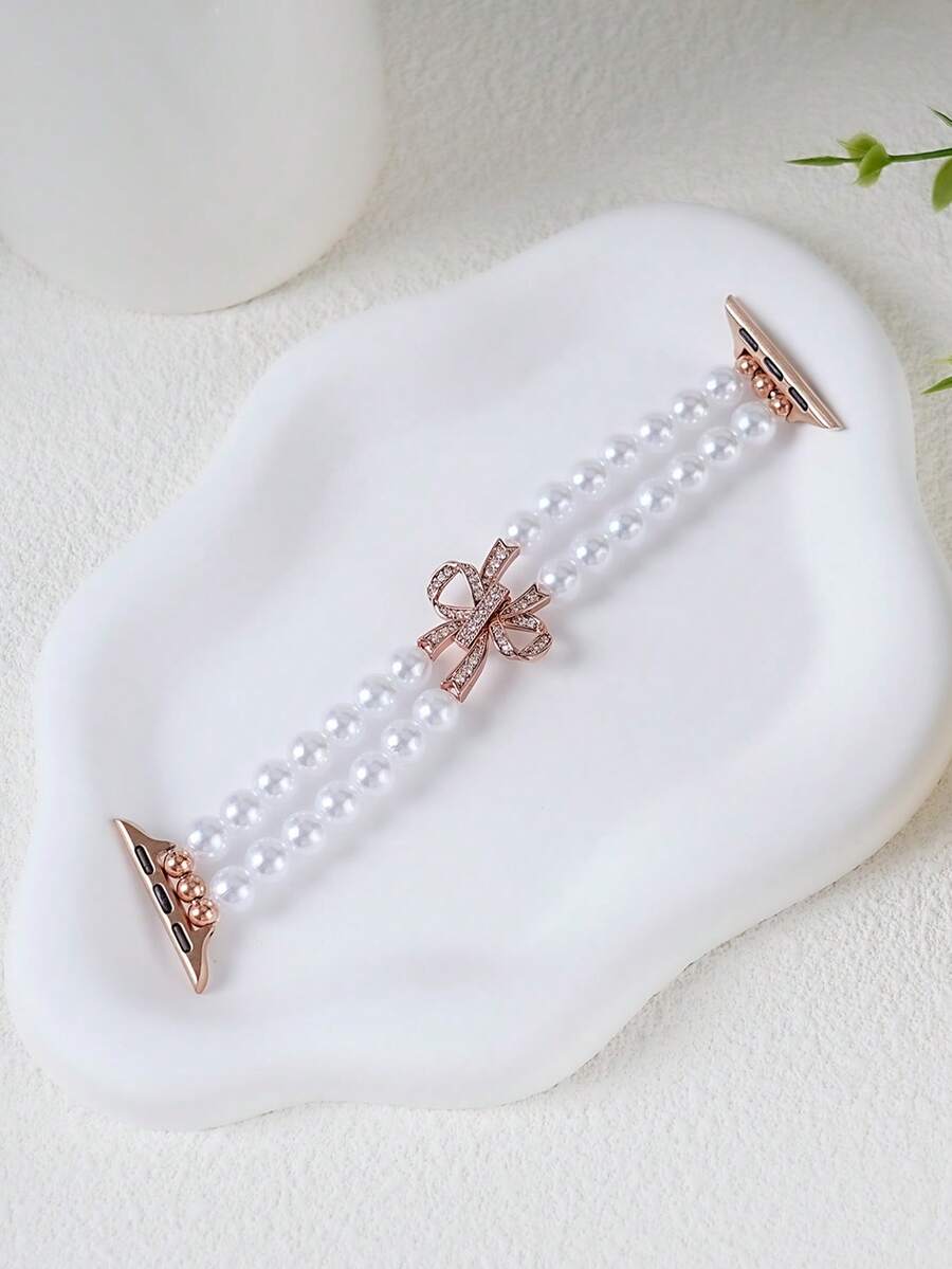 1条全新高端双排珍珠弹力表带，兼容，尺寸涵盖38mm、40mm、41mm、42mm、44mm、45mm、46mm、49mm，女士时尚款式，也兼容UltraS10/S11/9/8/7/6/5/4/3/2/1智能手环（不含手表）。是送给女友和朋友的最佳礼物，非常适合情人节、圣诞节、新年、母亲节、感恩节，也是给家人或朋友的惊喜礼物。 - 玫瑰金 - 查看 1