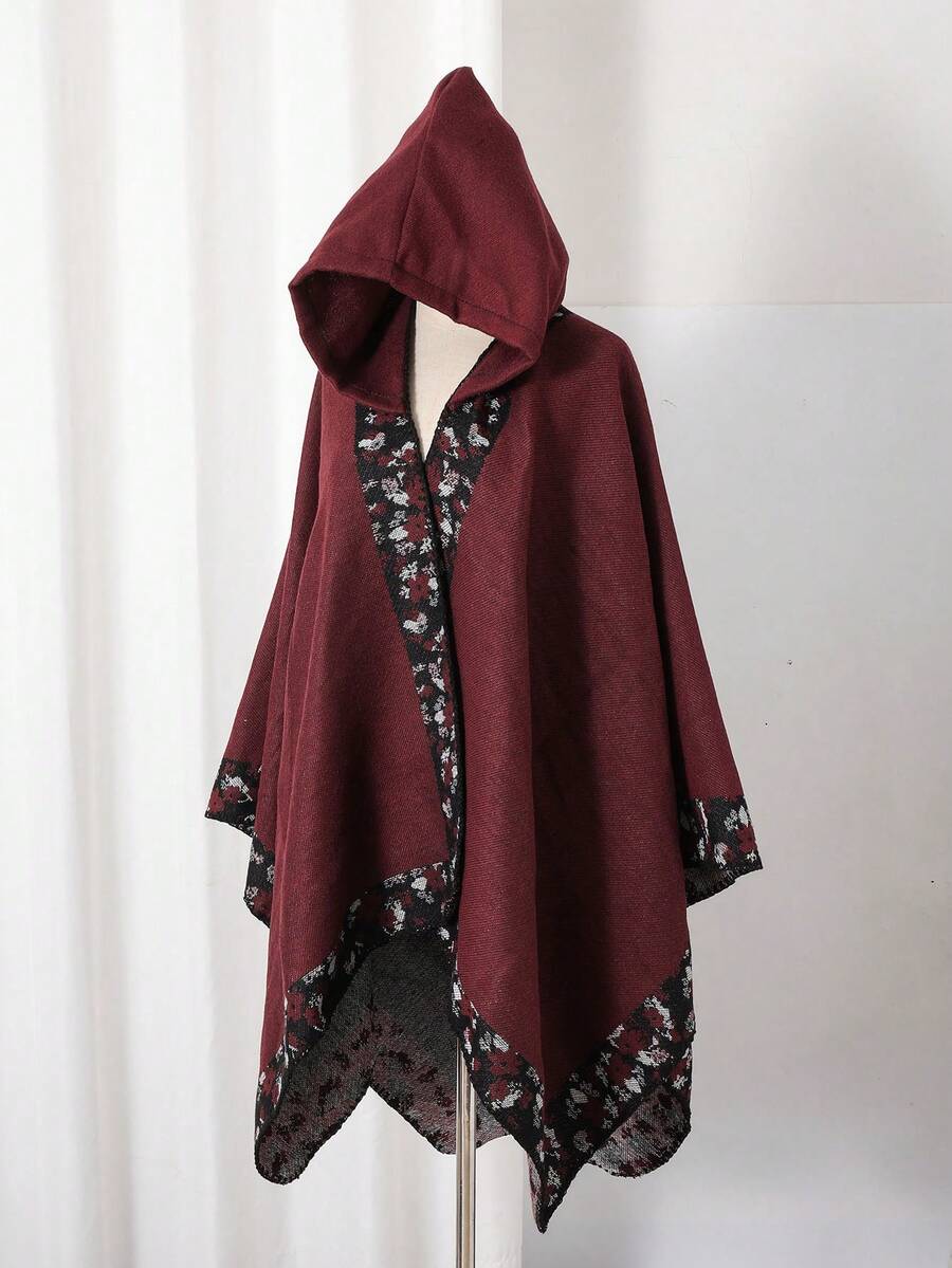 1 st. jacquard-poncho med huva
