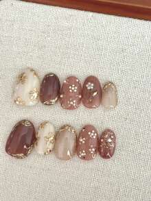 10 Móng Tay Giả Hình Oval - Thiết Kế Phong Cách Cổ Điển Thanh Lịch Tông Màu Trung Tính: Nền Nâu Hạt Dẻ/Beige/Hồng Nhạt với Họa Tiết Hoa Vàng Vẽ Tay, Điểm Nhấn Ngọc Trai & Viền Mạ Vàng, Bề Mặt Bóng Mịn, Móng Giả Có Thể Tháo Lắp Tái Sử Dụng (Tặng kèm Keo Dán Móng + Giũa Móng Mini) - Follow Your Heart - Xem 10