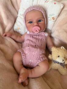 1个13英寸（约33厘米）柔软硅胶重生娃娃，名为Loulou，解剖结构精准，手工绘制，血管清晰可见，触感柔软，适合作为生日礼物或家庭聚会礼物。 - Reborn Doll - 查看 7