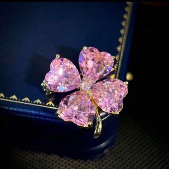 เข็มกลัดใบโคลเวอร์สี่แฉกประกายระยิบระยับสวยงาม, เข็มกลัดติดปกเสื้อสีเขียวหรูหราสำหรับสตรีระดับไฮเอนด์, เครื่องประดับแฟชั่นใหม่