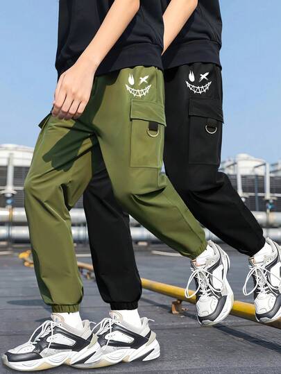 Tween Boys' Personalized-Catching Street-Style Casual Long Pants With Black, Green Color Block And Funny Face Print, Suitable For Daily Wear, School, Commuting, Spring/Summer/Autumn