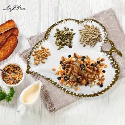 1 件套瓷质开胃菜拼盘，四格叶形糖果坚果托盘，可盛放干果、甜点等，尺寸 10.8 英寸 x 11.96 英寸，白色底金色装饰，四格陶瓷托盘，可盛放水果、糖果、坚果等，金边瓷质开胃菜托盘，分隔式托盘