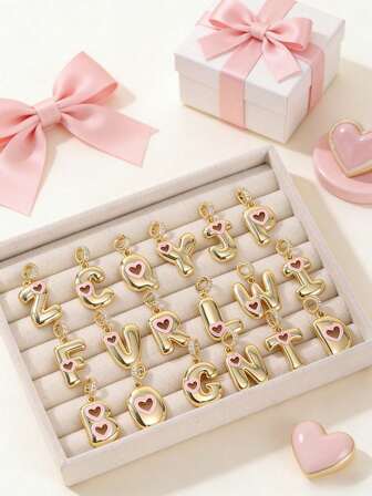 1 pieza Colgante versátil y de moda con diseño de letra dorada del alfabeto 26 y corazón hueco rosa, adecuado para collar, pulsera, llavero, colgante de teléfono, joyería, unisex
