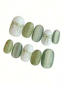 10片纯手工制作的按压式美甲贴片，短款椭圆形美甲贴片，绿色美甲贴片，简约甜美风格，绿白猫眼手绘蝴蝶结银珠装饰，可爱温柔日常按压式美甲贴片，适合女性和女孩，春夏秋冬节日派对及日常生活使用。 - 綠色 - 查看 2
