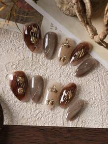 10片亚克力按压式美甲，杏仁形美甲，猫眼金叶图案，短款假指甲，人造指甲套装，包含1张粘合贴片和1个迷你指甲锉。