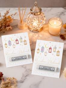 6个开斋节礼金袋，饰有色彩缤纷的灯笼和图案，专为装现金礼物而设计。印有“斋月吉祥”字样，是斋月庆祝活动的完美之选，适合作为开斋节礼物、斋月装饰品和开斋节餐桌摆设。 - 彩色 - 查看 3