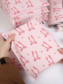 20个装心形粉色蝴蝶结红色丝带收纳袋，PE塑料邮寄袋，加厚物流袋，适用于女性、情人节、母亲节、返校季、交通运输、服装、文具、派对礼品包装，多功能包装，理想的节日礼品包装，满足您的所有需求 - 粉色 - 查看 2