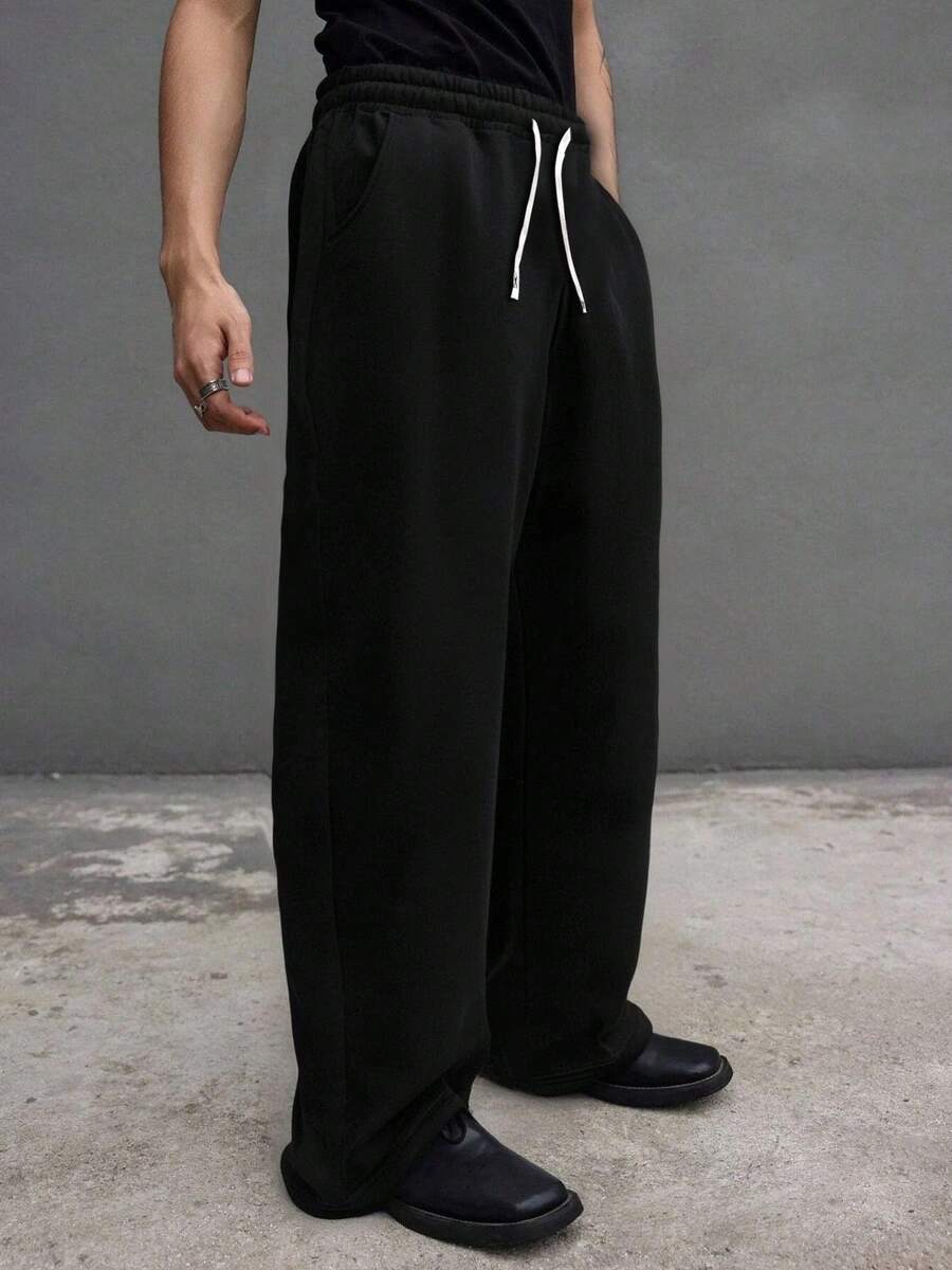 Quần nỉ thể thao màu đen dáng rộng cỡ lớn dành cho nam, thiết kế dây rút, thoải mái và đa năng - màu đen - Xem 1