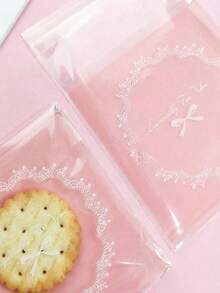 100 túi tự dính màu hồng có nơ ren, túi đựng bánh quy dễ thương, túi đựng kẹo bánh trong suốt có thể đóng mở lại, đồ dùng gói quà trang sức và quà tặng tiệc tùng thanh lịch. - Nhiều màu - Xem 2