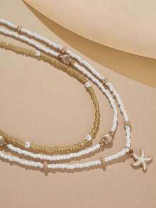 3件套简约串珠项链套装，包含仿珍珠、贝壳和海星，手工制作，充满海滩海洋风情，适合日常佩戴和度假。