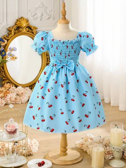 Vestido de princesa azul con estampado de frutas, manga abullonada, diseño de volantes y cintura elástica con lazo, estilo escolar casual para niña, adecuado para uso al aire libre, vuelta al colegio, ir y venir, reuniones sociales, primavera/verano