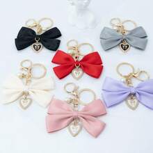 1个布艺蝴蝶结和仿珍珠心形钥匙扣，适合作为生日礼物、情人节礼物、汽车装饰、包包挂饰或情侣或女友的学习用品。 - 兔耳蝴蝶結 - 查看 13