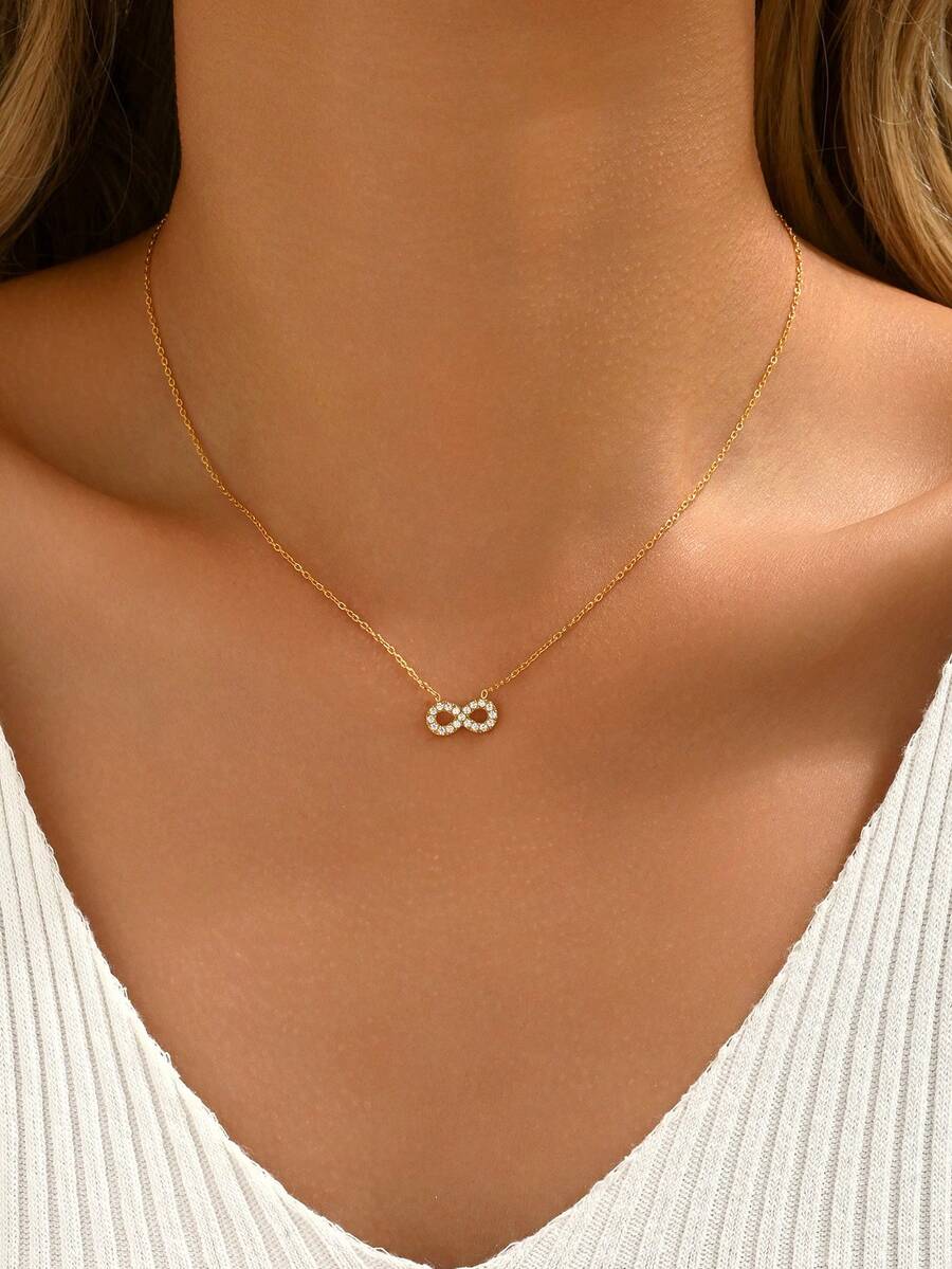 1件优雅的无限符号吊坠项链，简约而不失精致的设计，镶嵌闪亮水钻，适合日常佩戴、约会、派对等各种场合。