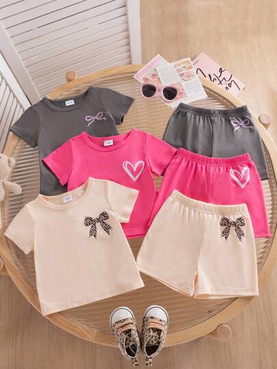 6 piezas Camisetas de manga corta con cuello redondo y decoración estampada en color albaricoque, gris y rosa rojo para niñas y niños pequeños, combinadas con 3 pares de pantalones cortos, adecuado para uso diario y uniforme escolar