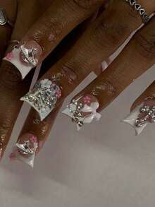 24片法式长款白色美甲贴纸，3D花瓣、十字架、星星装饰，镶嵌水钻，完美贴合亚克力假指甲，包含1瓶果冻胶和1把指甲锉，适合女性和女孩DIY、日常、节日派对等场合。 - 查看 2