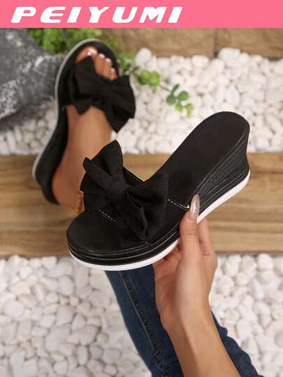 Giày sandal đế xuồng thời trang nữ, trang trí nơ, đế dày giúp tăng chiều cao, phù hợp cho cả trong nhà và ngoài trời.