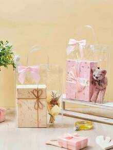 12个透明塑料礼品袋，带提手，可重复使用，配有丝带蝴蝶结，适用于婚礼、生日派对和节日礼品包装 - 淺粉色 - 查看 3