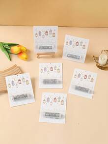 6个开斋节礼金袋，饰有色彩缤纷的灯笼和图案，专为装现金礼物而设计。印有“斋月吉祥”字样，是斋月庆祝活动的完美之选，适合作为开斋节礼物、斋月装饰品和开斋节餐桌摆设。 - 彩色 - 查看 4