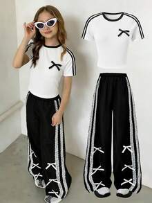 甜美休闲女童T恤两件套，简约蝴蝶结圆领短袖白色上衣，黑色阔腿裤侧边饰有蕾丝缎带和蝴蝶结，适合上学、聚会、户外活动和日常穿着。 - 黑色 - 查看 5