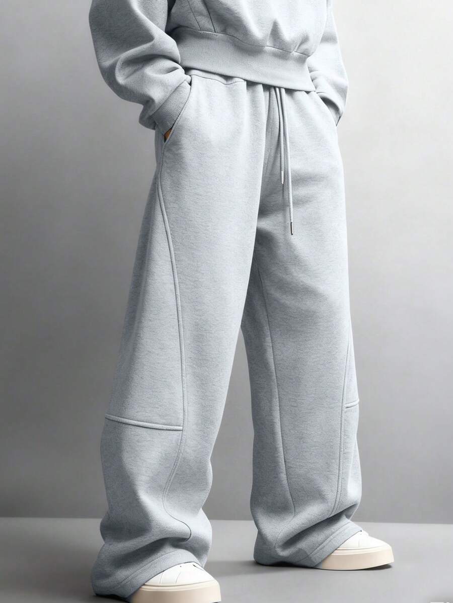 Quần thể thao nam màu trơn, có dây rút ở eo và túi, dáng rộng, màu xám. - Màu Xám nhạt - Xem 1