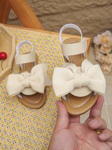 1 đôi dép xăng đan đế bằng mũi bướm mới cho bé gái mùa xuân và hè, giày công chúa dễ thương đa năng cho trẻ em, giày La Mã chống trượt phù hợp cho du lịch, kỳ nghỉ và đi học. - Màu be - Xem 3