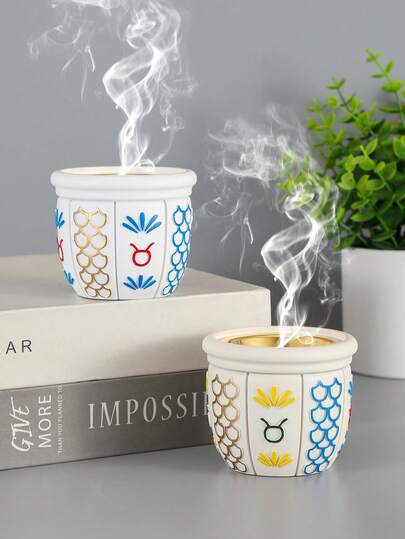 En rökelsekar i harts med arabisk stil och rund koppdesign. Den är lämplig för heminredning, festivaldekoration, kontorsdekoration och aromaterapi, och kan även användas som souvenir. Det är en perfekt present till bästa vänner, högtidspresenter, Ramadanpresenter, presenter till kvinnor, vinterpresenter och bröllopspresenter.