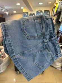 Short saia cargo Jeans Cintura Alta Femininas jeans sem esticar short saia com bolso100% algodão - Lavagem Média - Visão 4