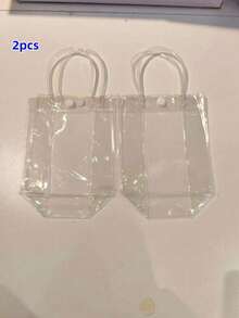 20 túi quà bằng nhựa trong suốt có quai xách và nơ đỏ - Túi đựng quà bằng PVC trong suốt có thể tái sử dụng cho đám cưới, họp mặt bạn bè, tiệc sinh nhật. - Trong sáng - Xem 18