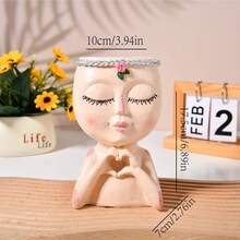 这款熔模人脸造型花盆造型独特，适合室内植物，是一款可爱的小型多肉植物花盆，底部有排水孔，是馈赠佳品（白色）。