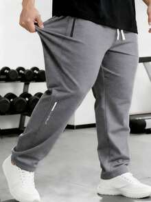 Pantalon de survêtement décontracté pour hommes grande taille - Pantalon de sport doux et léger, convenant pour la course, les entraînements en salle de gym, le port décontracté quotidien, avec cordon de serrage à la taille et poches zippées pour les sports d'hiver - Gris - Voir 6