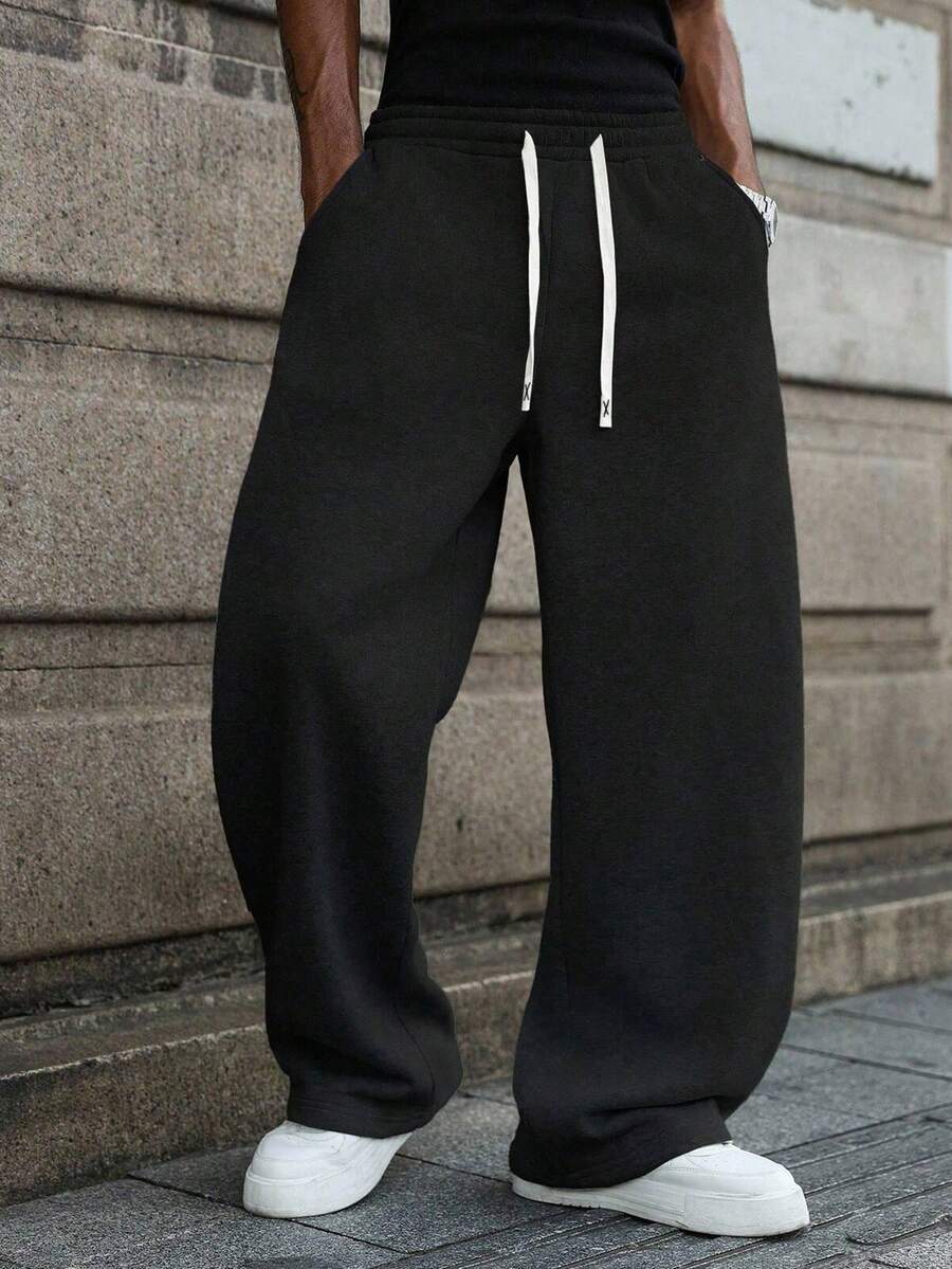 Pantaloni da uomo a gamba dritta con vita regolabile, pantaloni casual ampi in felpa, stile semplice adatto per pendolarismo quotidiano, uscite casual, appuntamenti serali, sport all'aperto, moda da strada, versatili per primavera/estate - nero - Visualizzare 1