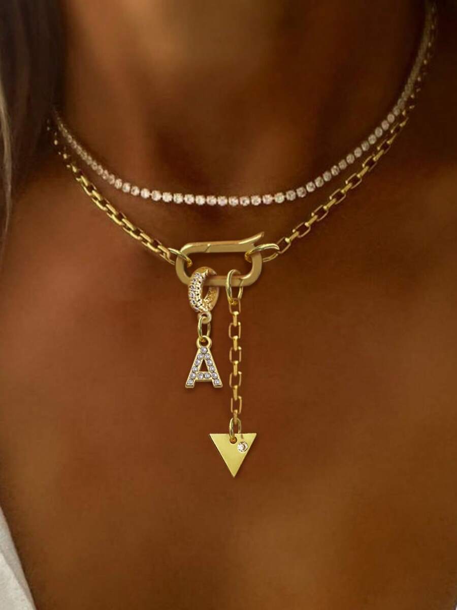 1件STYLEVER金色字母吊坠项链，配以水钻三角形吊坠和不锈钢链，适合工作、日常生活、派对、宴会和舞会等场合，尽显奢华气质。 - 金黃色 - 查看 1