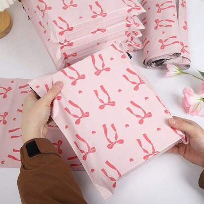 20 piezas Bolsas de almacenamiento con diseño de corazón, lazo rosa, cinta roja, bolsas de plástico PE para envíos, bolsas de logística gruesas, adecuadas para mujeres, Día de San Valentín, Día de la Madre, vuelta al colegio, transporte, ropa, papelería, embalaje de regalos para fiestas, embalaje multifuncional, embalaje ideal para regalos festivos, que cubre todas sus necesidades
