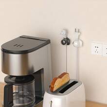 3个装电缆夹，有黑色、白色和灰色可选，强力粘合剂可固定电线、电缆和以太网插头，非常适合家庭和办公室桌面或墙面使用。