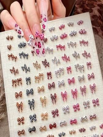 100个蝴蝶结爱心美甲饰品，蝴蝶结美甲水钻，豹纹设计，可爱树脂蝴蝶结美甲用品，迷你豹纹爱心美甲宝石，3D多色丝带蝴蝶结美甲饰品，女士美甲钻石