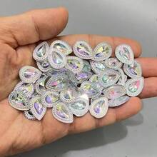 50颗AB彩扁平水钻，适用于美甲、婚礼工艺品、手足护理等。尺寸：13x18毫米（0.512*0.709英寸），需配合热熔胶使用。特点：光泽亮丽，切割精准，品质上乘。是DIY爱好者和美容专业人士的必备之选。 - 彩色 - 查看 5