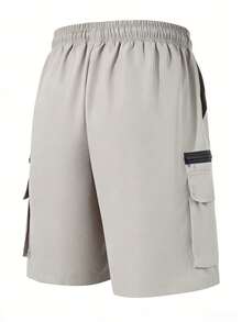 Pantalones cortos cargo para hombre de primavera-verano para exteriores con cintura elástica con cordón y bolsillos extragrandes con cremallera para senderismo, correr, trekking y uso diario - Gris Claro - Ver 5