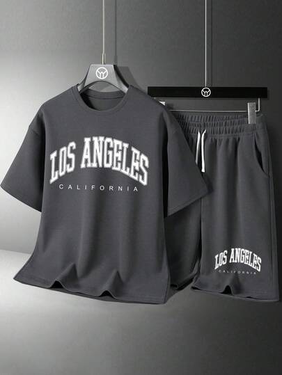 Conjunto de camiseta de manga corta con cuello redondo y estampado gráfico de letras, y pantalones cortos para niño joven