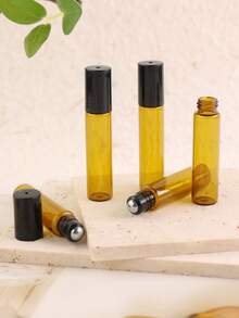 8/50 piezas Botellas de vidrio ámbar con bola de rodillo de 5ml - Diámetro inferior de 14mm con diseño delgado - El color ámbar evita la exposición a la luz para evitar la evaporación y reacción del líquido - Rellenable - Portátil para muestras de tamaño de viaje - Adecuado para perfume, aceites esenciales, aromaterapia, masaje - Excelente regalo para amigos y familiares - Multicolor - Ver 5