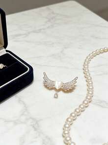 1 chiếc ghim cài áo hình cánh thiên thần màu trắng hình trái tim thời trang, đa năng với đá lấp lánh, có thể dùng làm phụ kiện cho quần áo, túi xách, khăn quàng cổ, thanh lịch và dễ thương, có thể tự làm thành vòng cổ, phù hợp cho phụ nữ đeo khi đi nghỉ mát, dự tiệc, hàng ngày, món quà tuyệt vời cho Ngày Valentine, Ngày của Mẹ, cho người yêu hoặc bạn bè. - đôi cánh trái tim trắng - Xem 5