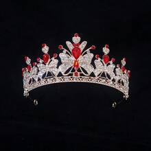 1件镶满水钻的蝴蝶核心元素吊坠，配以水滴形红宝石点缀，采用镂空纹理和小红宝石装饰，融合了甜美与奢华的风格，适合生日派对、拍照、正式礼服，也可作为儿童/青少年的装饰头饰。