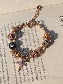 1 件女士可调节手链套装，带台球、星星、饰物、豹纹和时间饰物