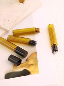 8/50 piezas Botellas de vidrio ámbar con bola de rodillo de 5ml - Diámetro inferior de 14mm con diseño delgado - El color ámbar evita la exposición a la luz para evitar la evaporación y reacción del líquido - Rellenable - Portátil para muestras de tamaño de viaje - Adecuado para perfume, aceites esenciales, aromaterapia, masaje - Excelente regalo para amigos y familiares - Multicolor - Ver 7